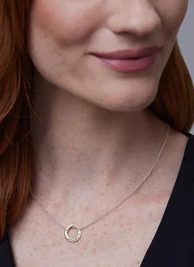 Close up of red haired model wearing 9ct Gold 